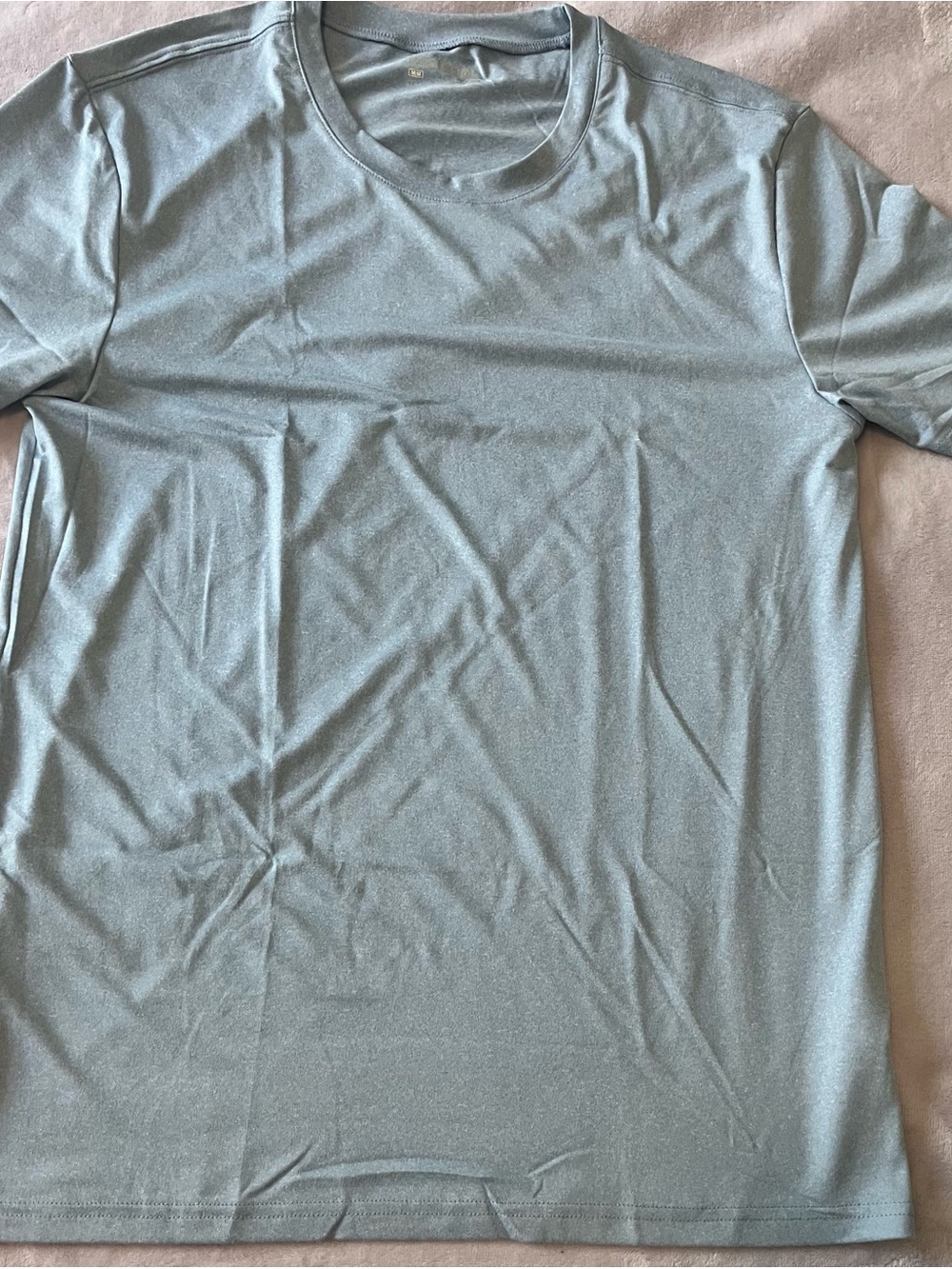 Soft blue green short-sleeve active tee.